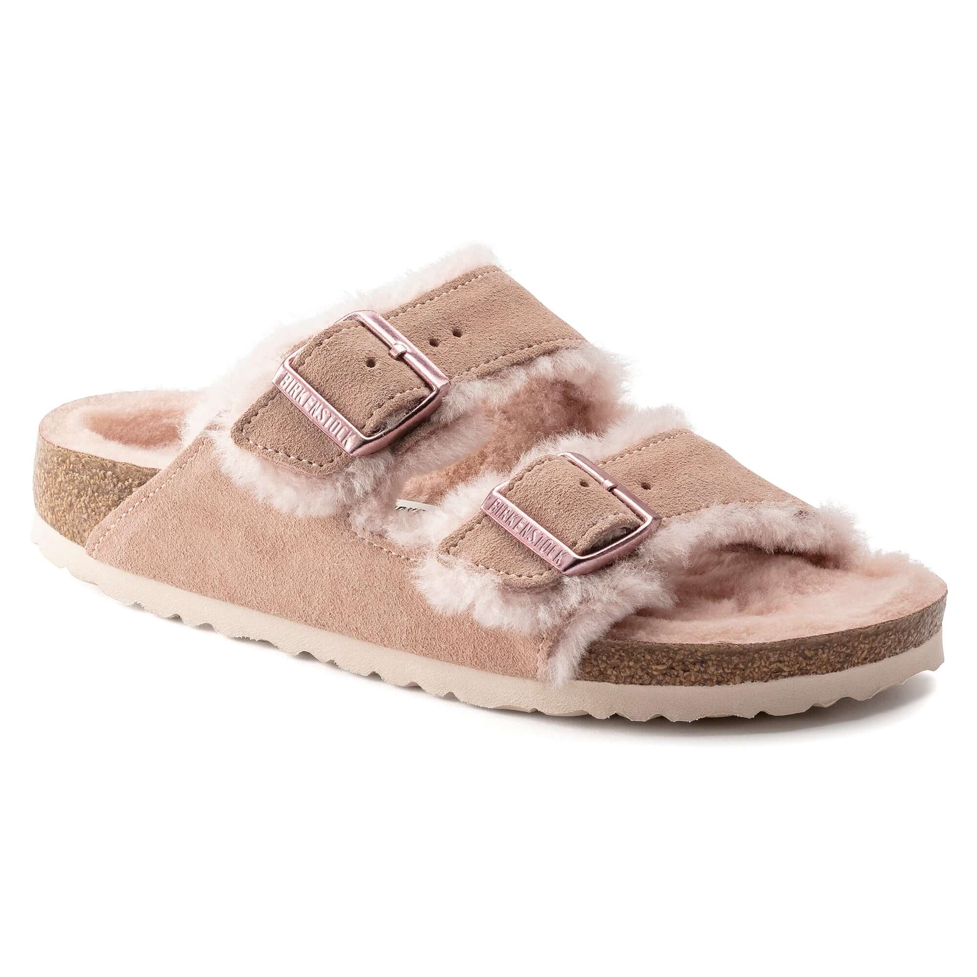 Pink fuzzy slide sandal with two adjustable straps and cork sole for comfort.