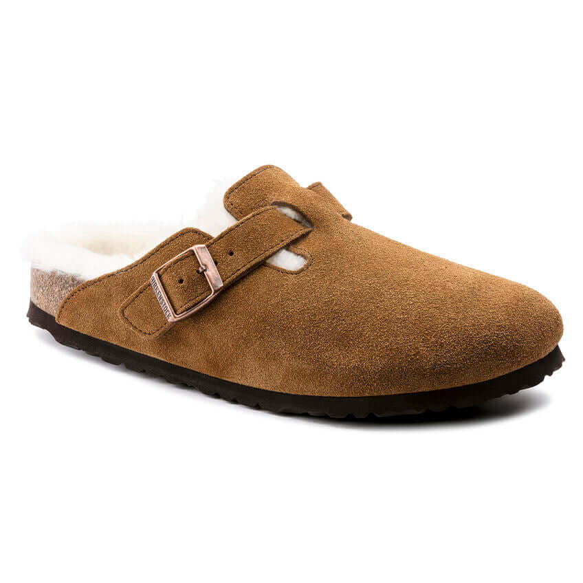 Brown suede clog with buckle and shearling lining on black sole