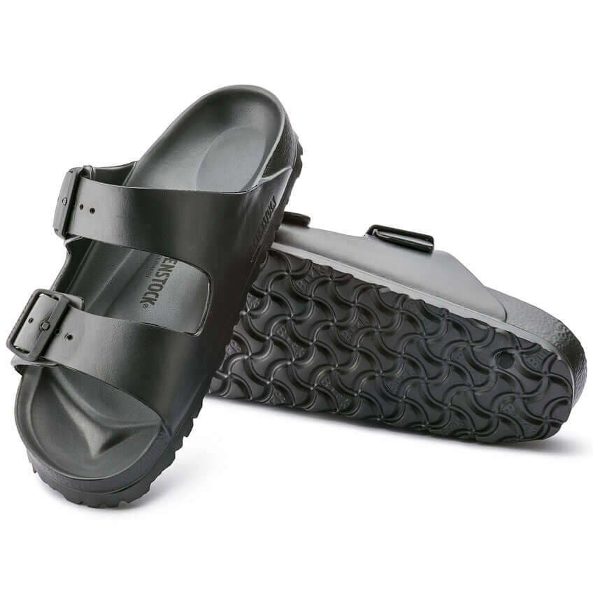 Black Birkenstock EVA Arizona sandals with double buckle straps and wavy rubber soles, perfect for casual summer wear.