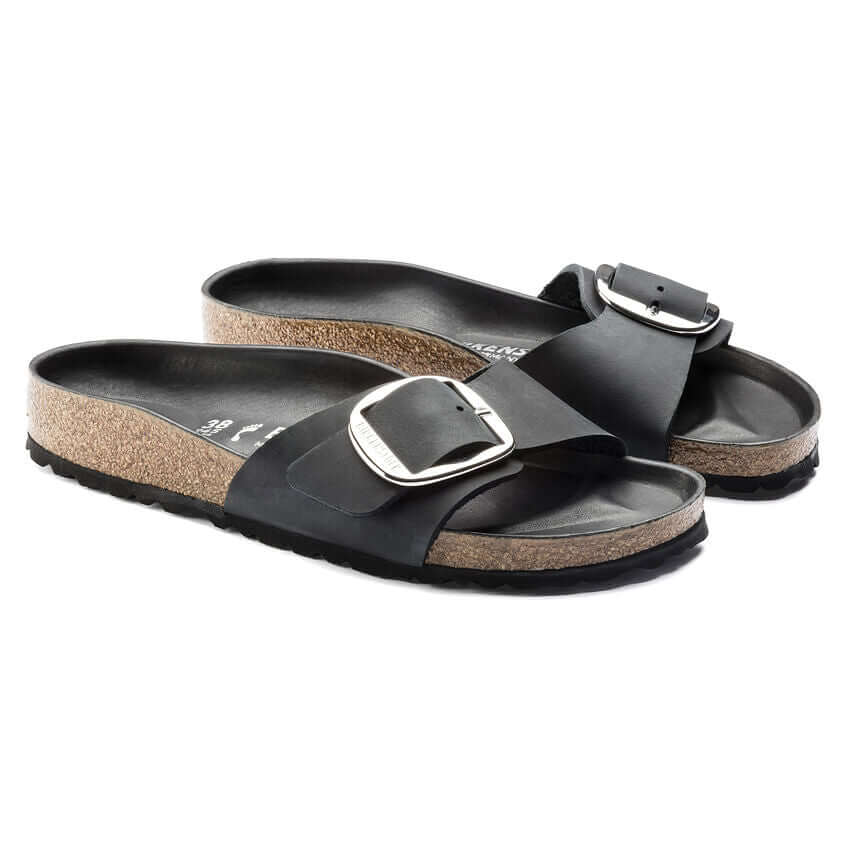 Black cork footbed sandals with large buckle straps