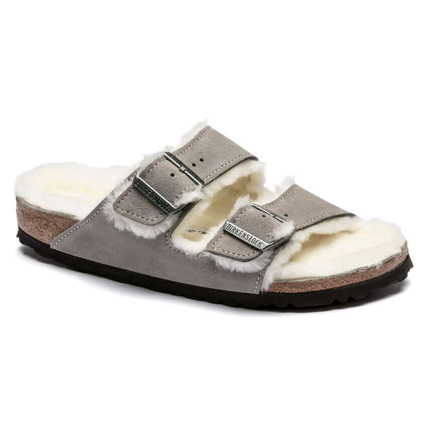 Comfortable grey fur-lined Birkenstock sandal with cork sole for cozy wear