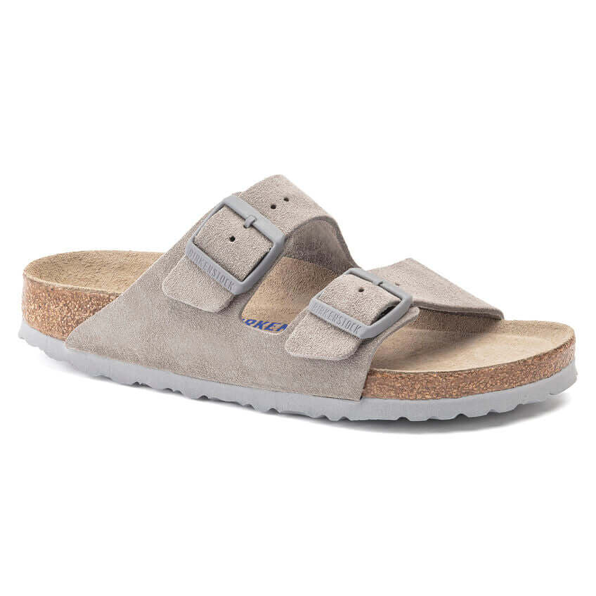 Taupe suede sandal with double buckle straps and cork sole.