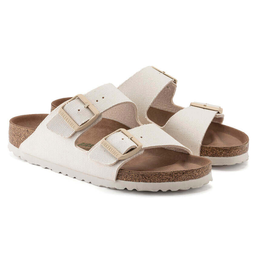 White cork sole sandals with double adjustable straps and buckles.