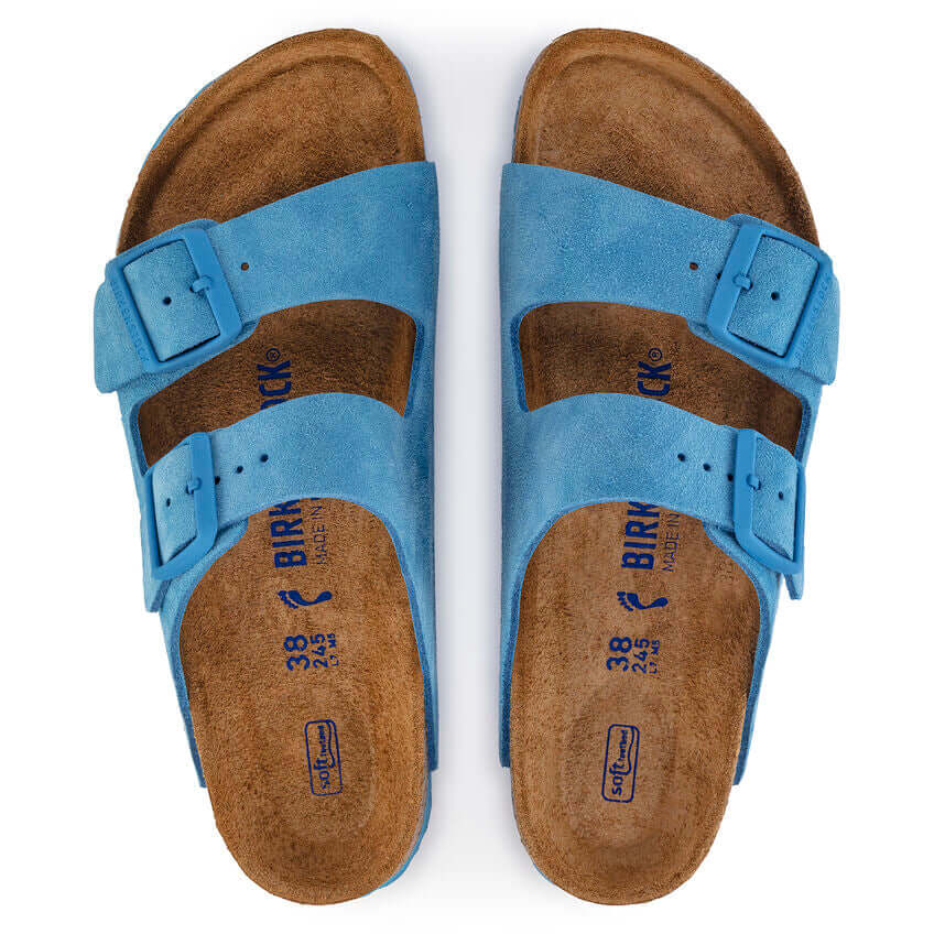 Top view of blue suede Birkenstock Arizona sandals with dual straps and buckles