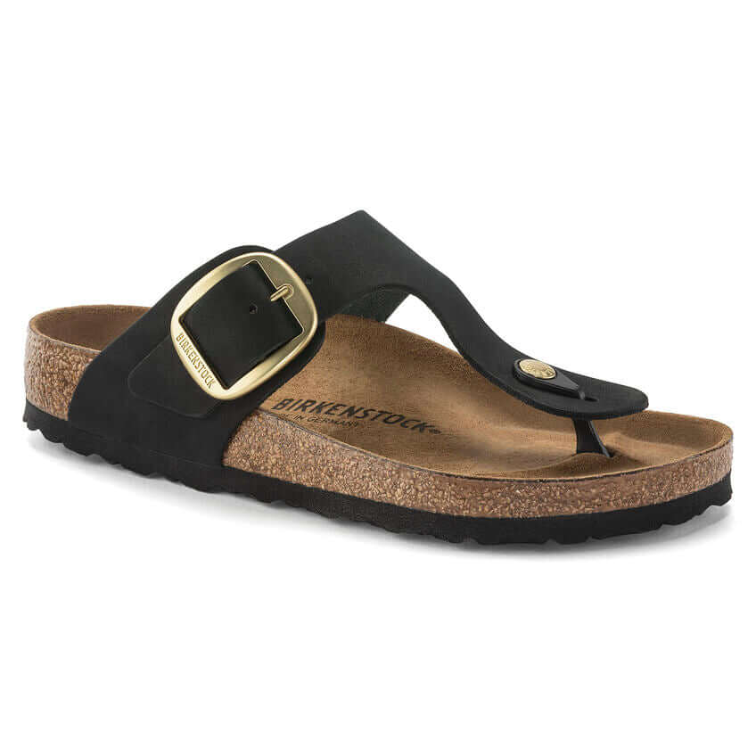 Black Birkenstock sandal with gold buckle and cork footbed