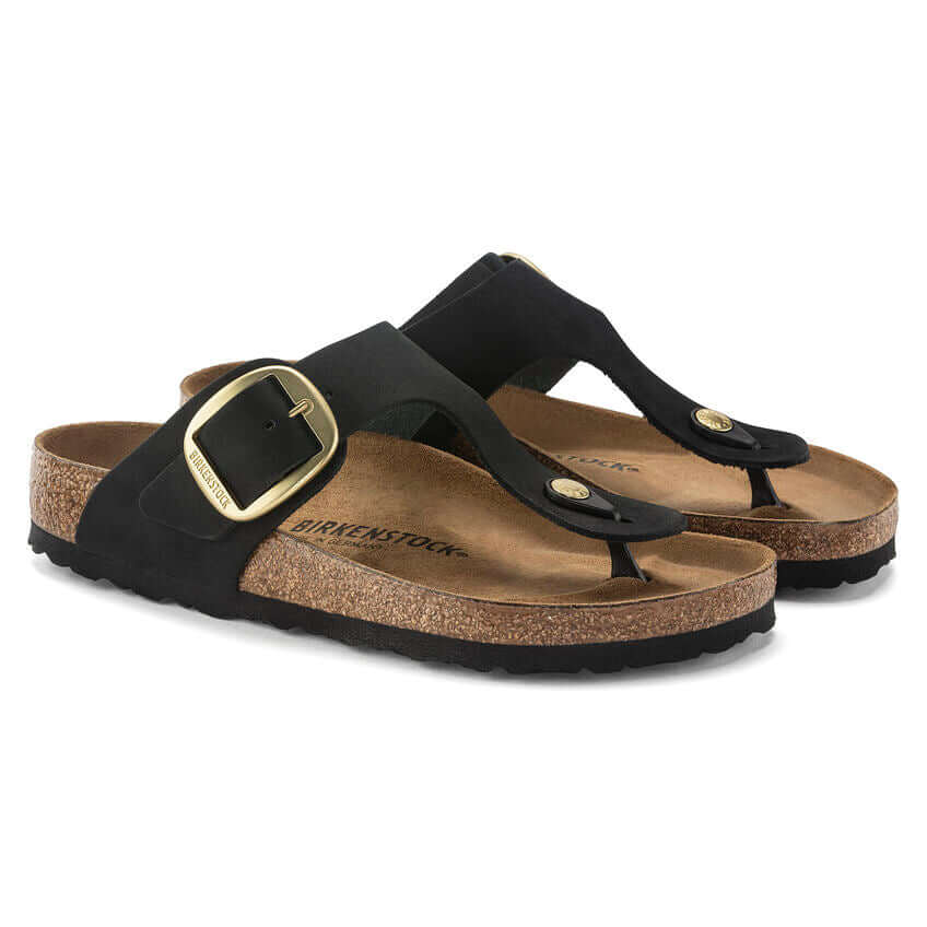 Black Birkenstock Gizeh sandals with cork footbed and large buckle.